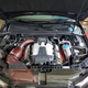 The completed engine bay, with the car’s Eventuri red kevlar intake all shined up.